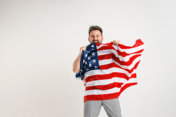 Image showing Young man with the flag of United States of America