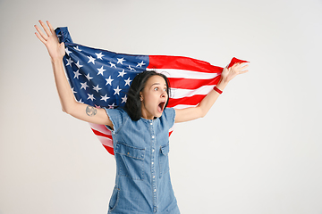 Image showing Young woman with the flag of United States of America