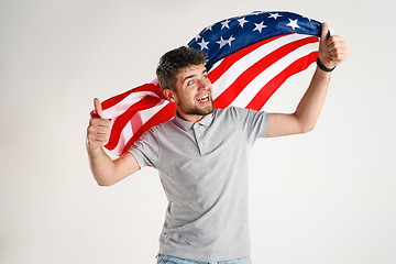 Image showing Young man with the flag of United States of America