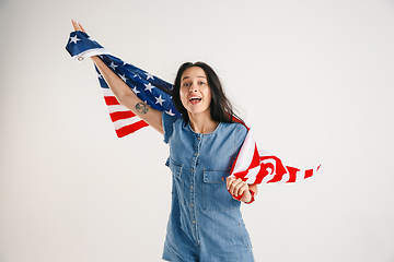 Image showing Young woman with the flag of United States of America