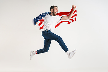 Image showing Young man with the flag of United States of America