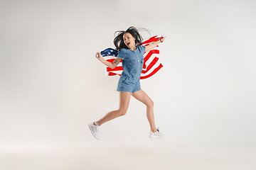 Image showing Young woman with the flag of United States of America