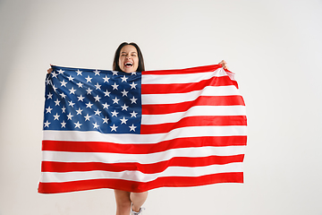 Image showing Young woman with the flag of United States of America