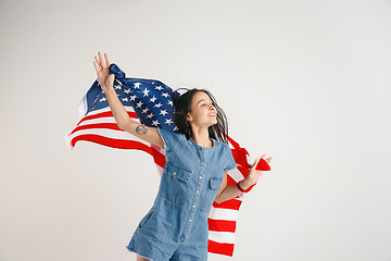 Image showing Young woman with the flag of United States of America