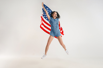 Image showing Young woman with the flag of United States of America