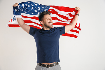 Image showing Young man with the flag of United States of America
