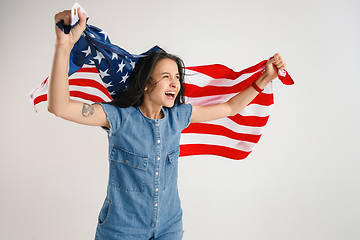 Image showing Young woman with the flag of United States of America