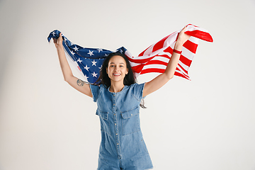 Image showing Young woman with the flag of United States of America