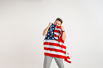 Image showing Young man with the flag of United States of America