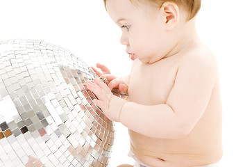 Image showing adorable baby boy with big disco ball