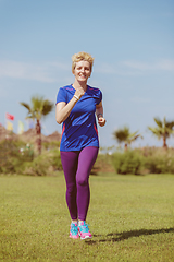 Image showing young female runner training for marathon