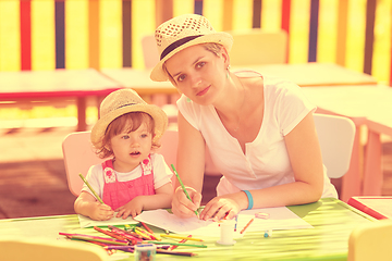 Image showing mom and little daughter drawing a colorful pictures