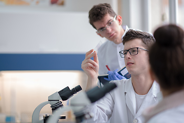 Image showing Group of young medical students doing research