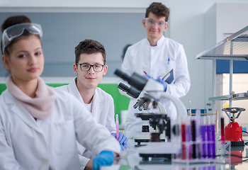 Image showing Group of young medical students doing research