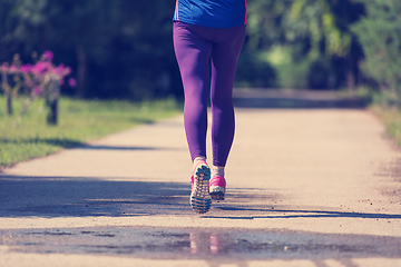 Image showing young female runner training for marathon