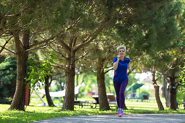 Image showing young female runner training for marathon