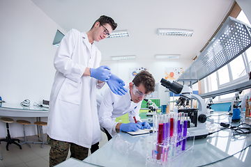 Image showing Group of young medical students doing research