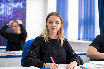 Image showing female student writing notes