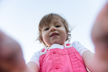 Image showing little girl spending time at backyard