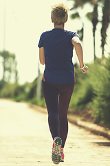 Image showing young female runner training for marathon