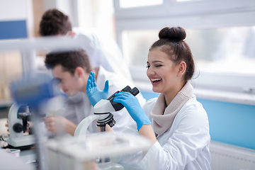 Image showing Group of young medical students doing research