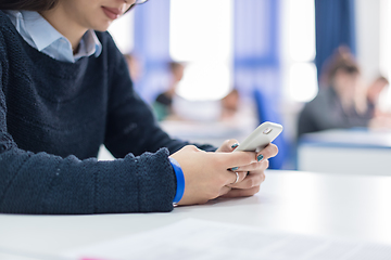 Image showing female student using a mobile phone