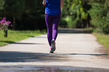 Image showing young female runner training for marathon