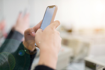 Image showing female student using a mobile phone