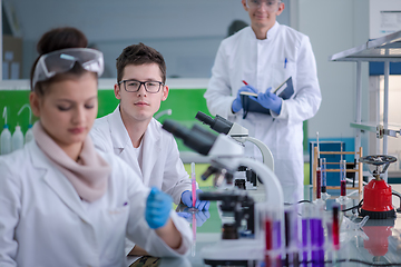 Image showing Group of young medical students doing research