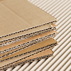 Image showing Cardboard pile on corrugated background