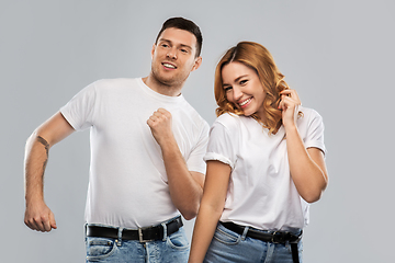 Image showing portrait of happy couple in white t-shirts dancing