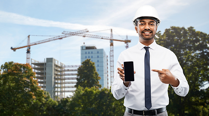 Image showing architect showing smartphone at construction site