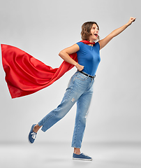 Image showing happy woman in red superhero cape