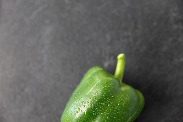 Image showing close up of green pepper on slate stone background