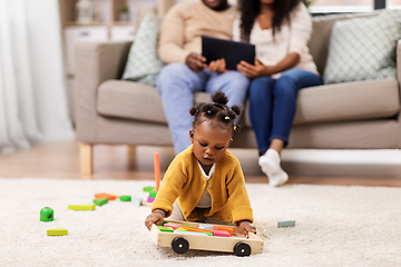 Image showing family with tablet pc and toy blocks at home