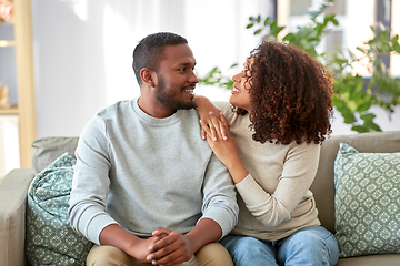 Image showing happy african american couple talking at home