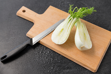 Image showing fennel and kitchen knife on wooden cutting board