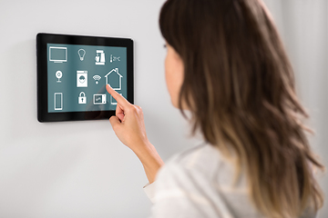 Image showing woman using tablet computer at smart home