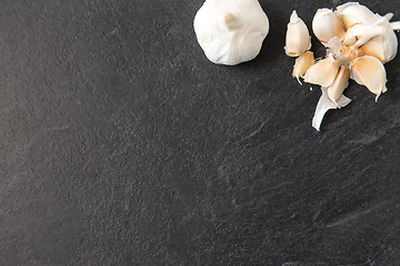 Image showing garlic on slate stone background