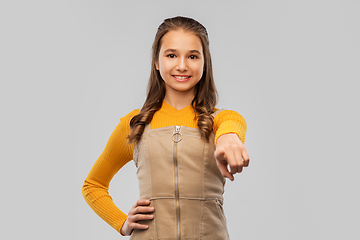 Image showing smiling young teenage girl pointing to camera