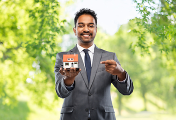 Image showing indian man realtor with house model