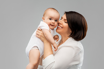 Image showing happy middle-aged mother with little baby daughter