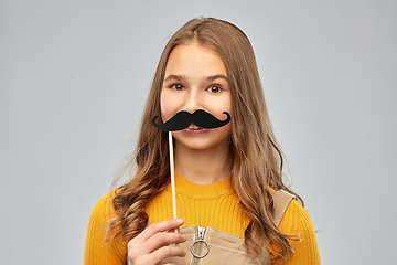 Image showing teenage girl with black moustaches party accessory