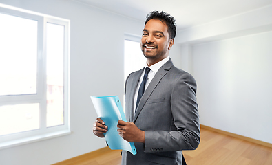 Image showing indian man realtor with folder at new apartment