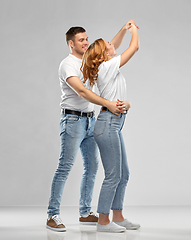 Image showing portrait of happy couple in white t-shirts dancing