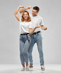 Image showing portrait of happy couple in white t-shirts dancing