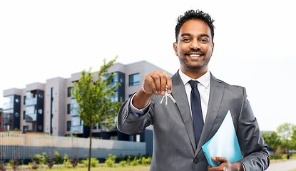 Image showing indian man realtor with home keys on city street