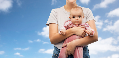 Image showing happy young mother holding little baby daughter