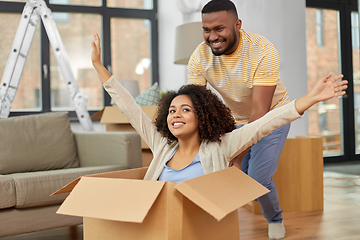 Image showing happy couple moving to new home and having fun