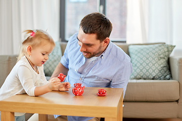 Image showing father and daughter playing tea party at home